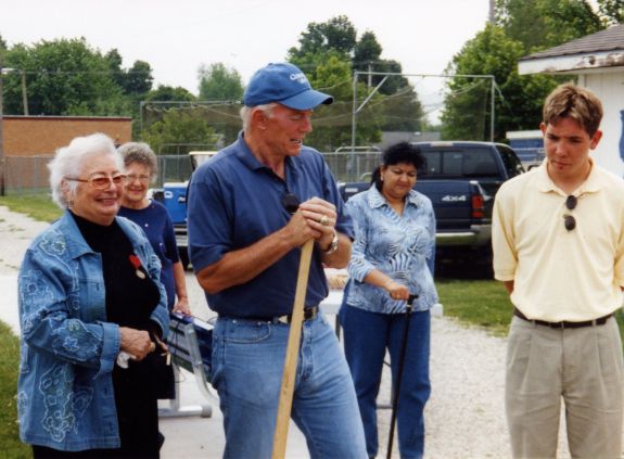 Arminta & her son Jerry Jones planting a cherry tree